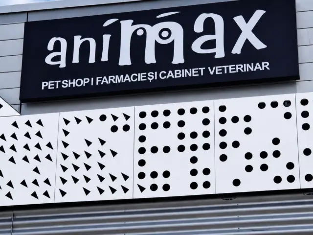 Black Animax facade sign identifying a pet shop, veterinary pharmacy and veterinary clinic.